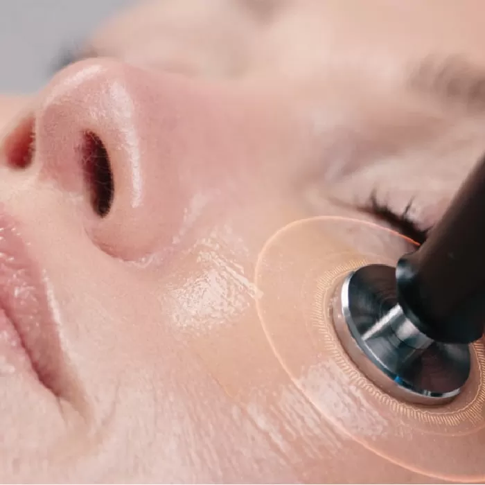 Electro-Sonic DF treatment on a client’s skin